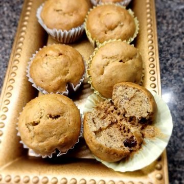 Banana cakes in a brown tray on the kitchen slab.
