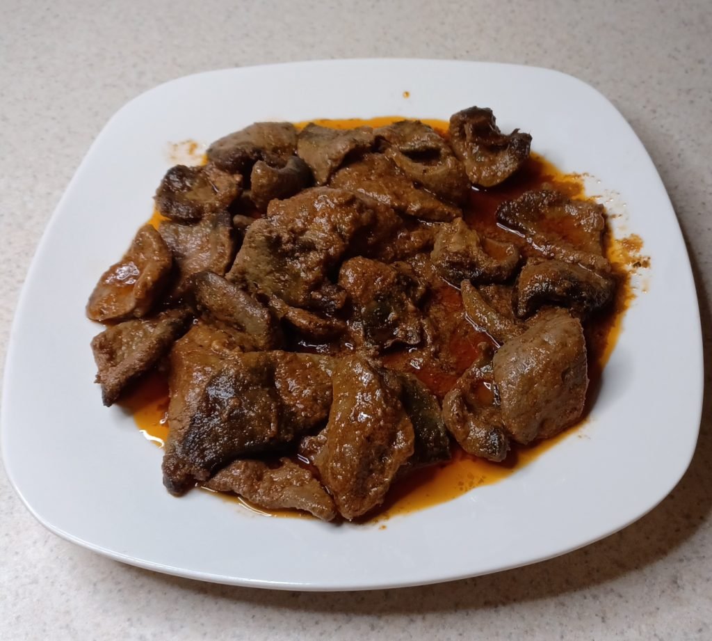 Liver sauce in a white dish on a white background.