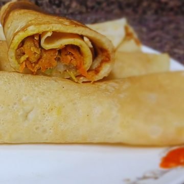 Pancake rolls in a white dish.