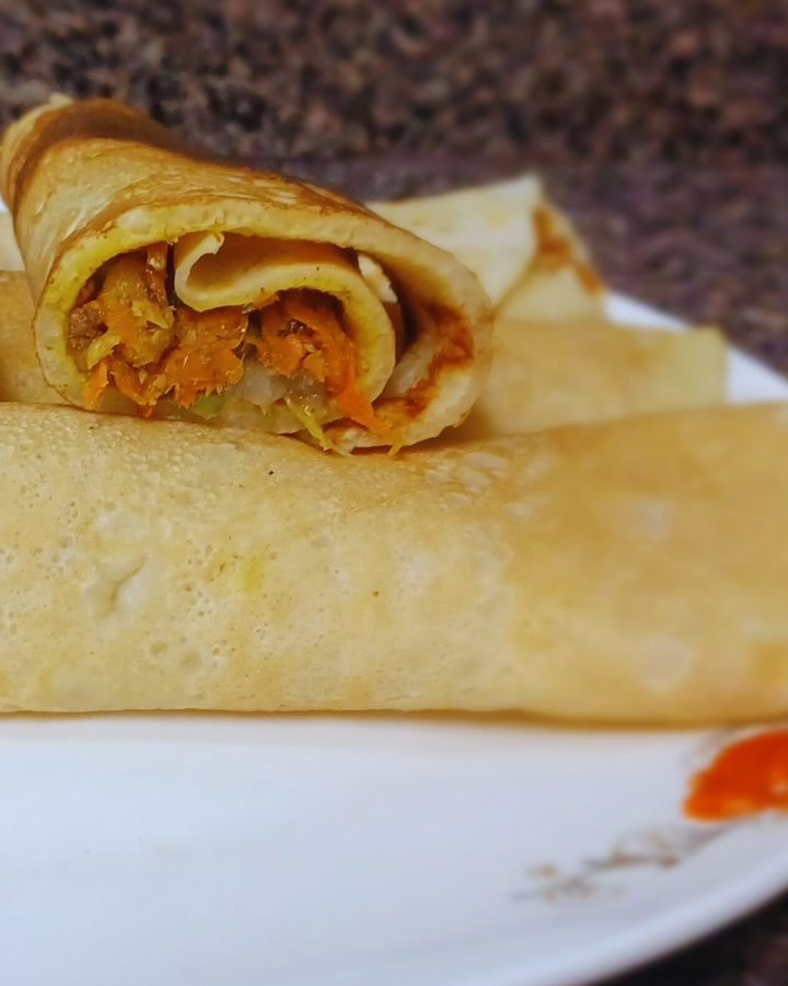 Pancake rolls in a white dish.