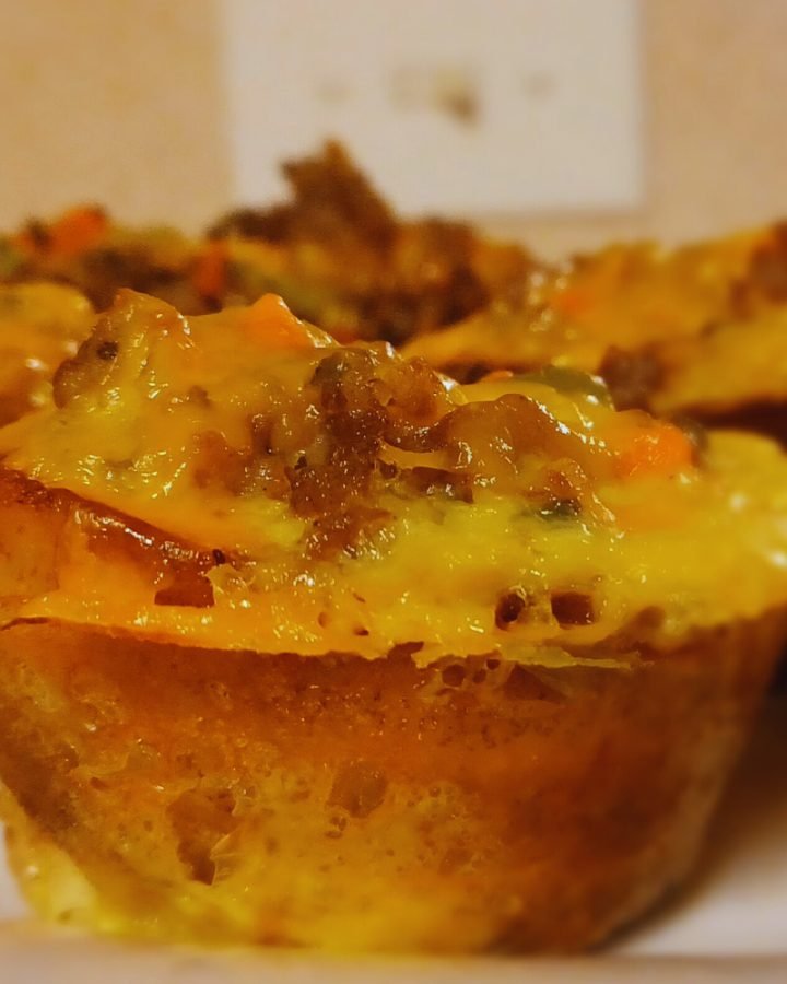Plantain cupcake meat pie in a white plate.