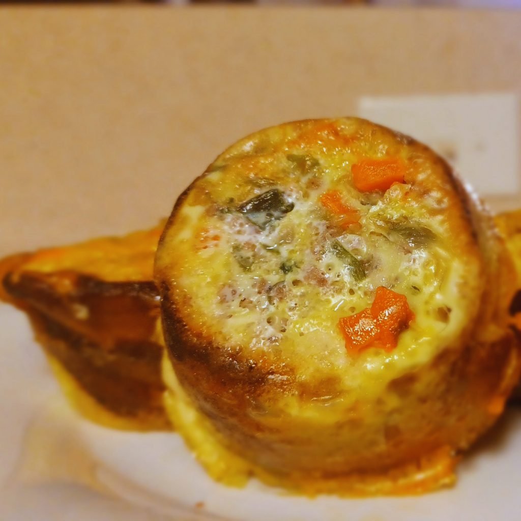 Plantain meat pie on a white plate. 
