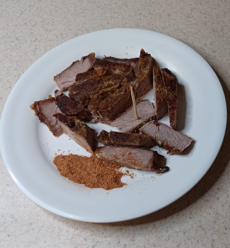 Soya, powder pepper, and a tooth pick on a white kitchen slab.