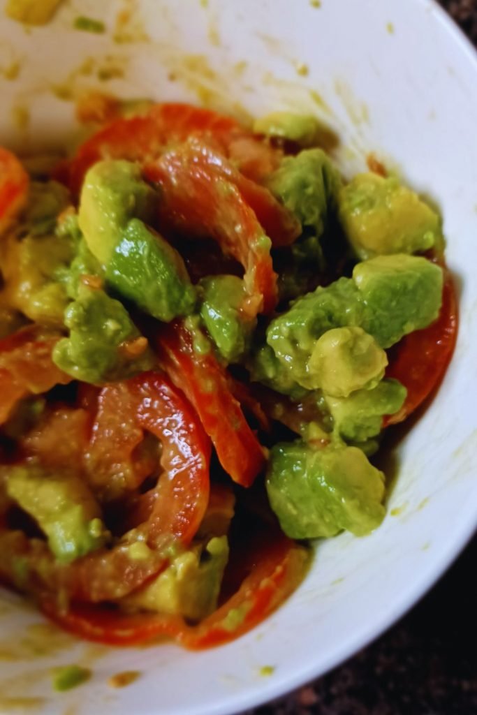 Avocat salad in a white bowl.