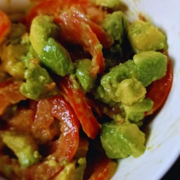 Avocat salad in a white bowl.